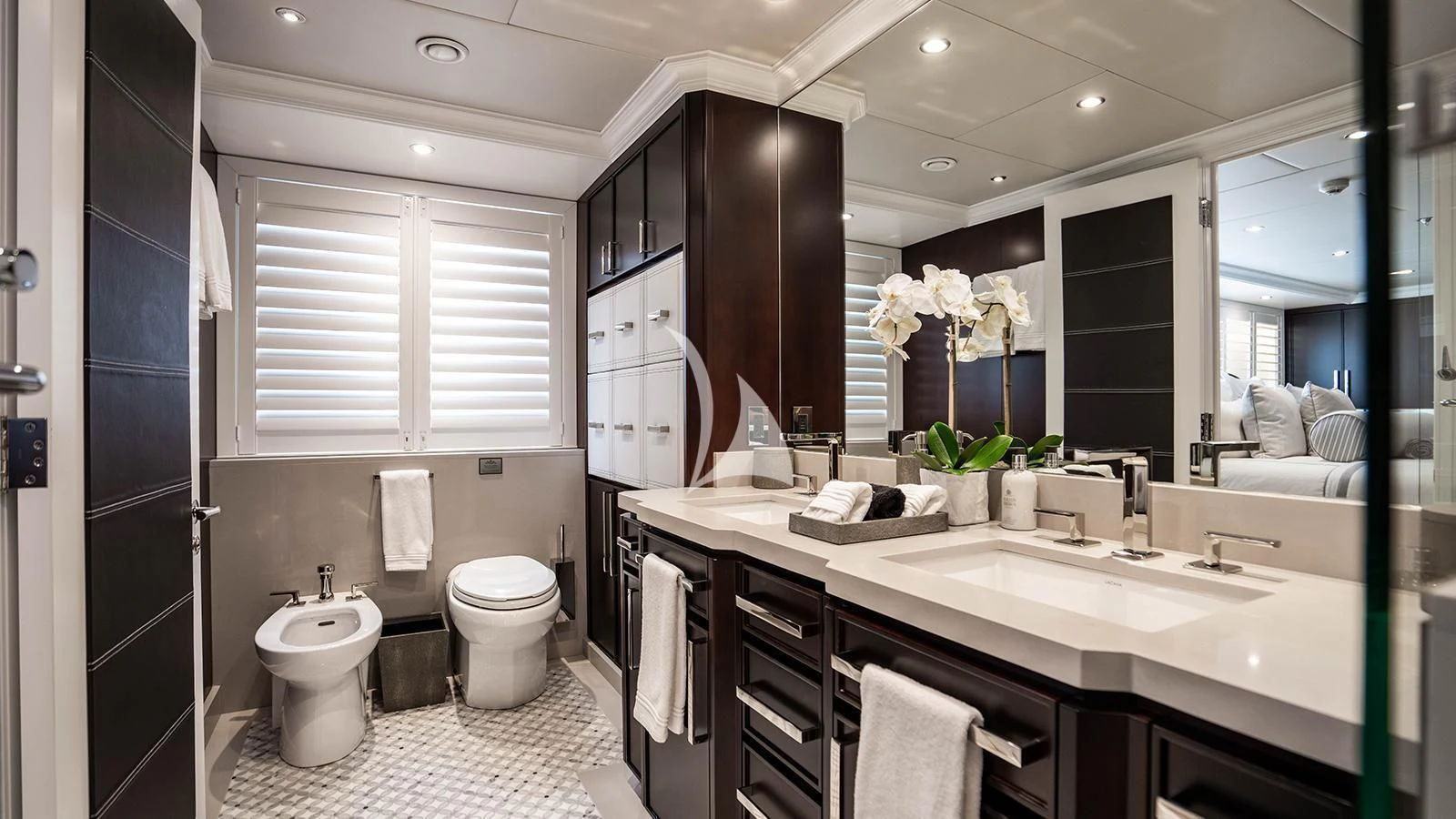 a bathroom with a large mirror aboard ALTA Yacht for Sale