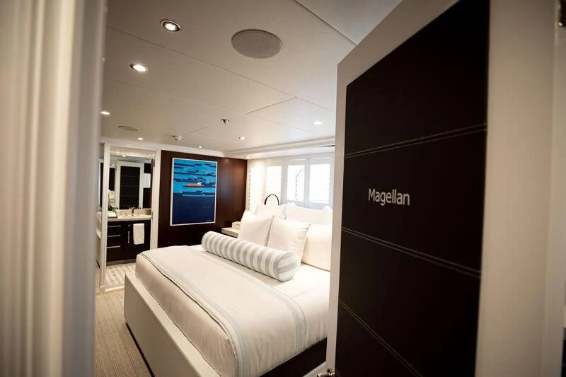 a room with a bed and a tv aboard ALTA Yacht for Sale