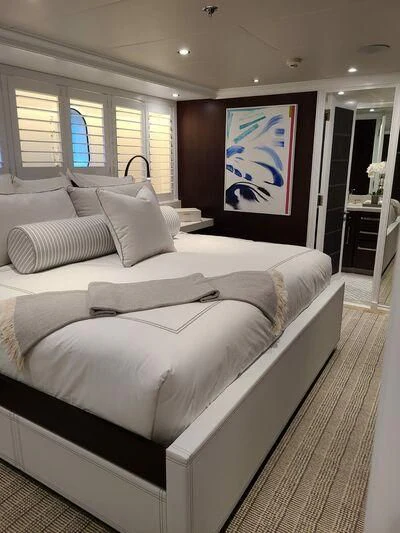 a large bed in a room aboard ALTA Yacht for Sale