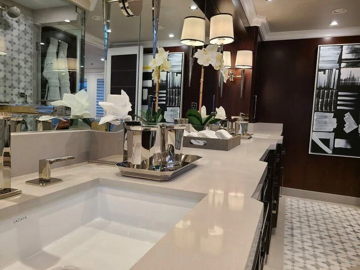 a bathroom with a large mirror aboard ALTA Yacht for Sale