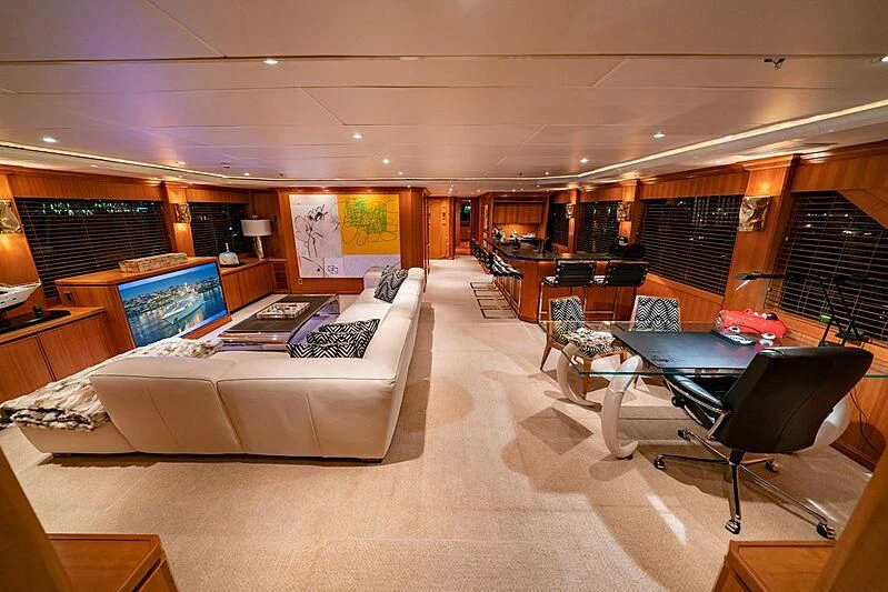 a large room with a couch and a table aboard ALTA Yacht for Sale