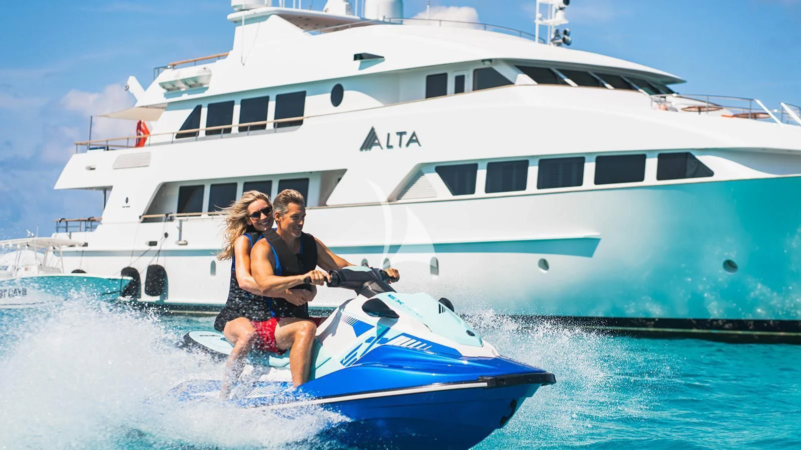 a man and woman on a boat aboard ALTA Yacht for Sale