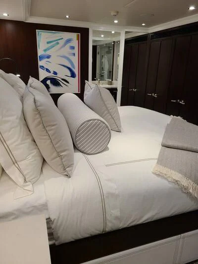 a white couch with pillows aboard ALTA Yacht for Sale
