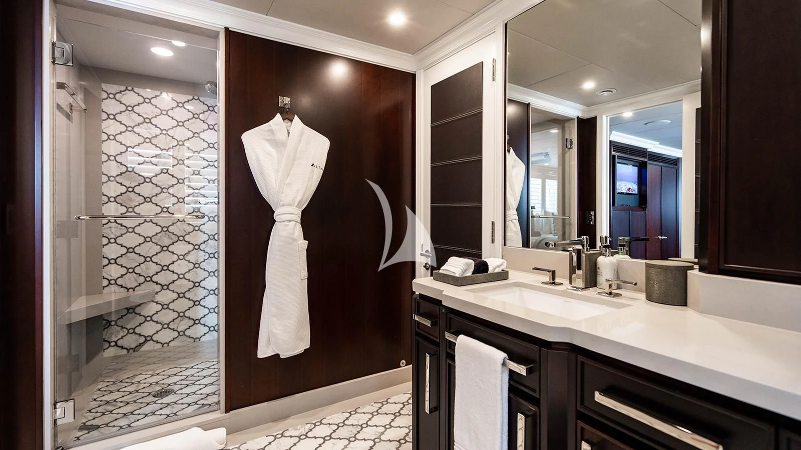 a bathroom with a large mirror aboard ALTA Yacht for Sale