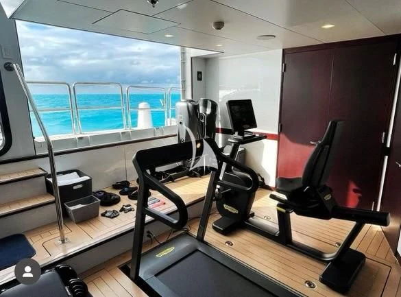a room with treadmills aboard ALTA Yacht for Sale