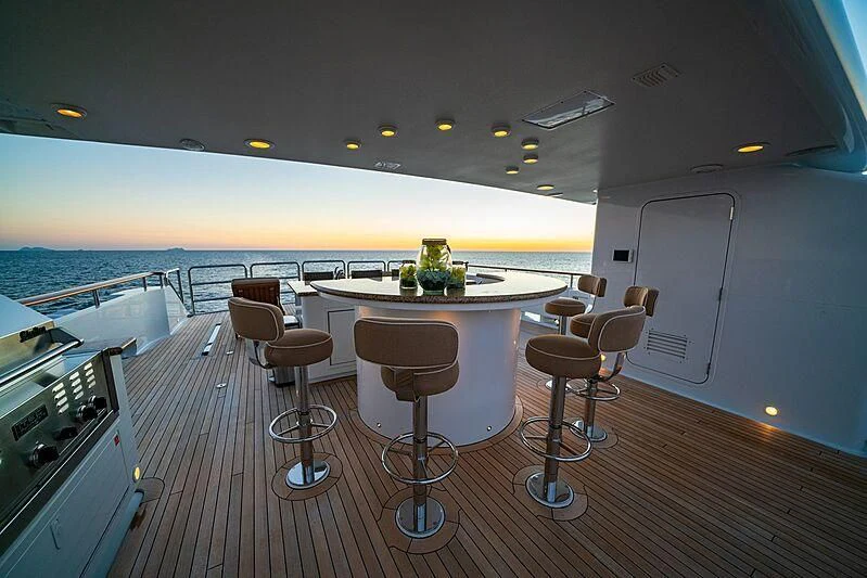 a room with a table and chairs aboard ALTA Yacht for Sale