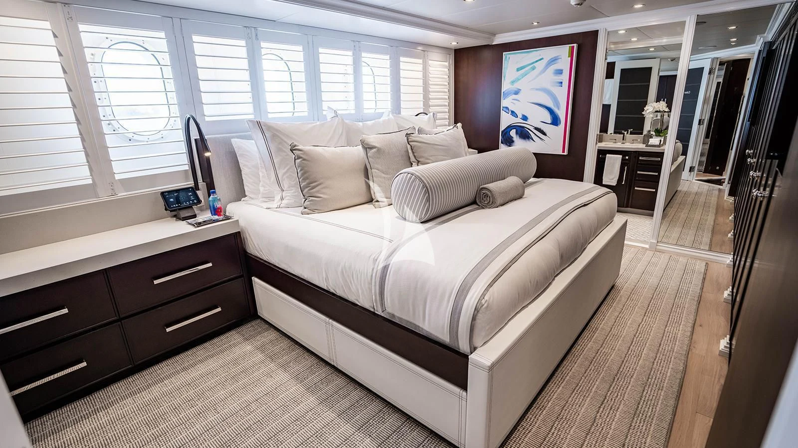 a room with a bed and desk aboard ALTA Yacht for Sale