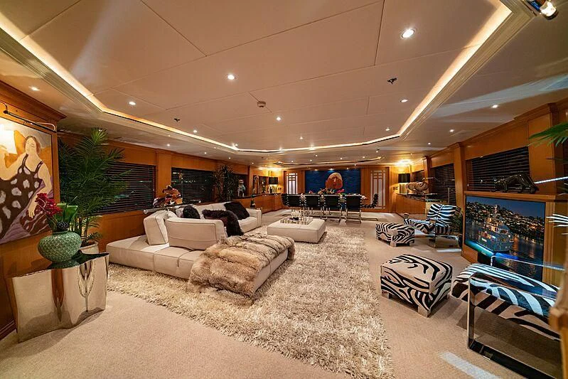 a large living room with a large screen aboard ALTA Yacht for Sale