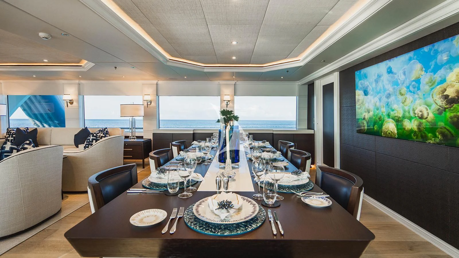 a large room with a table and chairs aboard ALTA Yacht for Sale