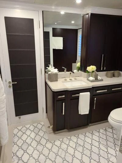 a bathroom with a sink and a mirror aboard ALTA Yacht for Sale
