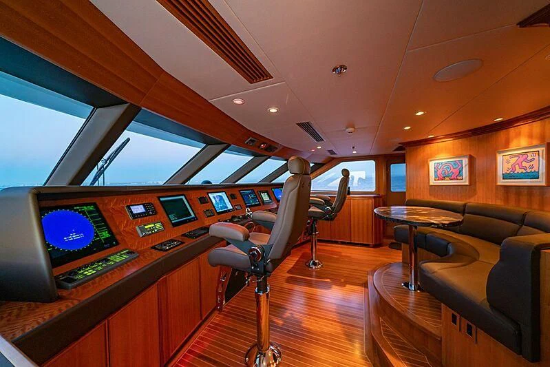 a room with a desk and chairs aboard ALTA Yacht for Sale