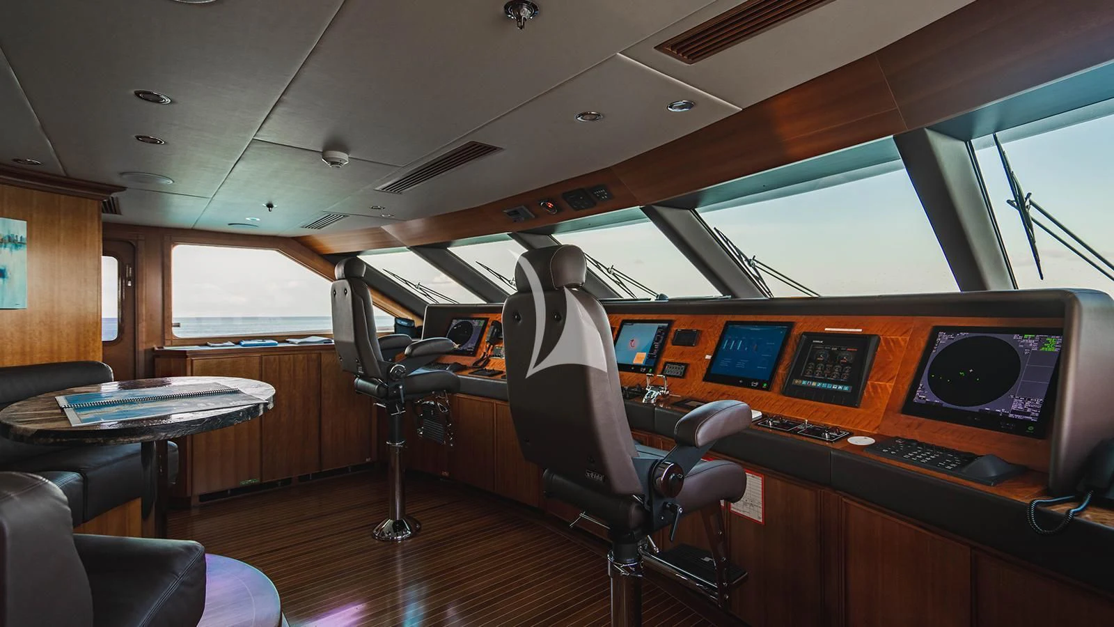 a room with a desk and chairs aboard ALTA Yacht for Sale