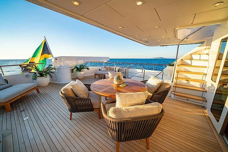 a living room with a large balcony aboard ALTA Yacht for Sale