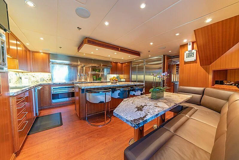 a large kitchen with a bar and bar aboard ALTA Yacht for Sale