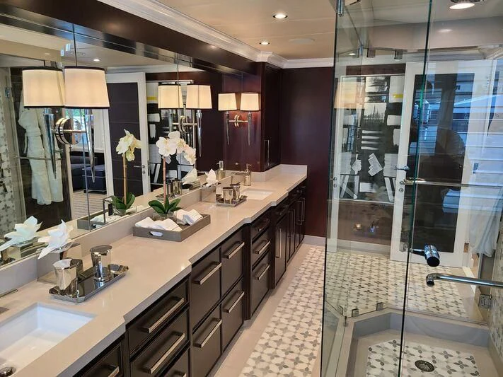 a bathroom with a large mirror aboard ALTA Yacht for Sale
