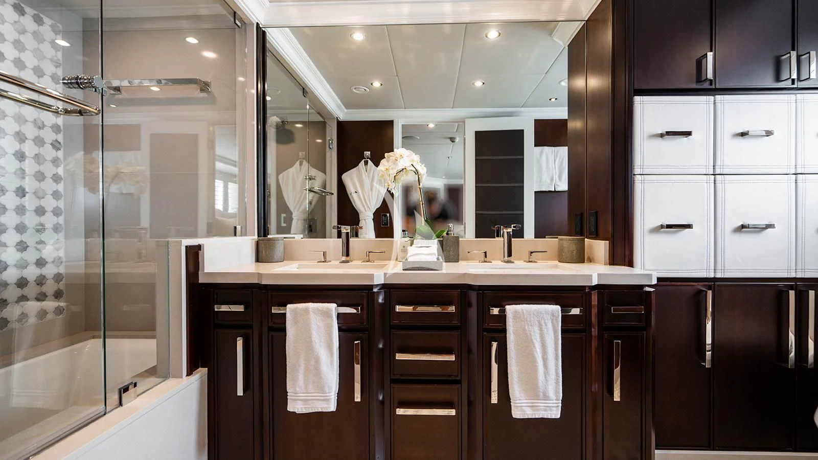a bathroom with a glass shower aboard ALTA Yacht for Sale