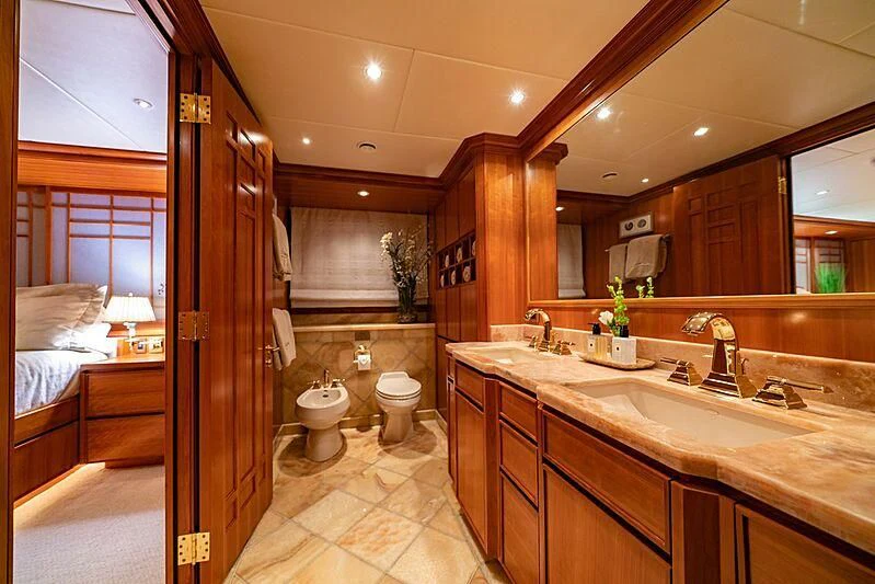 a bathroom with a sink toilet and a bathtub aboard ALTA Yacht for Sale