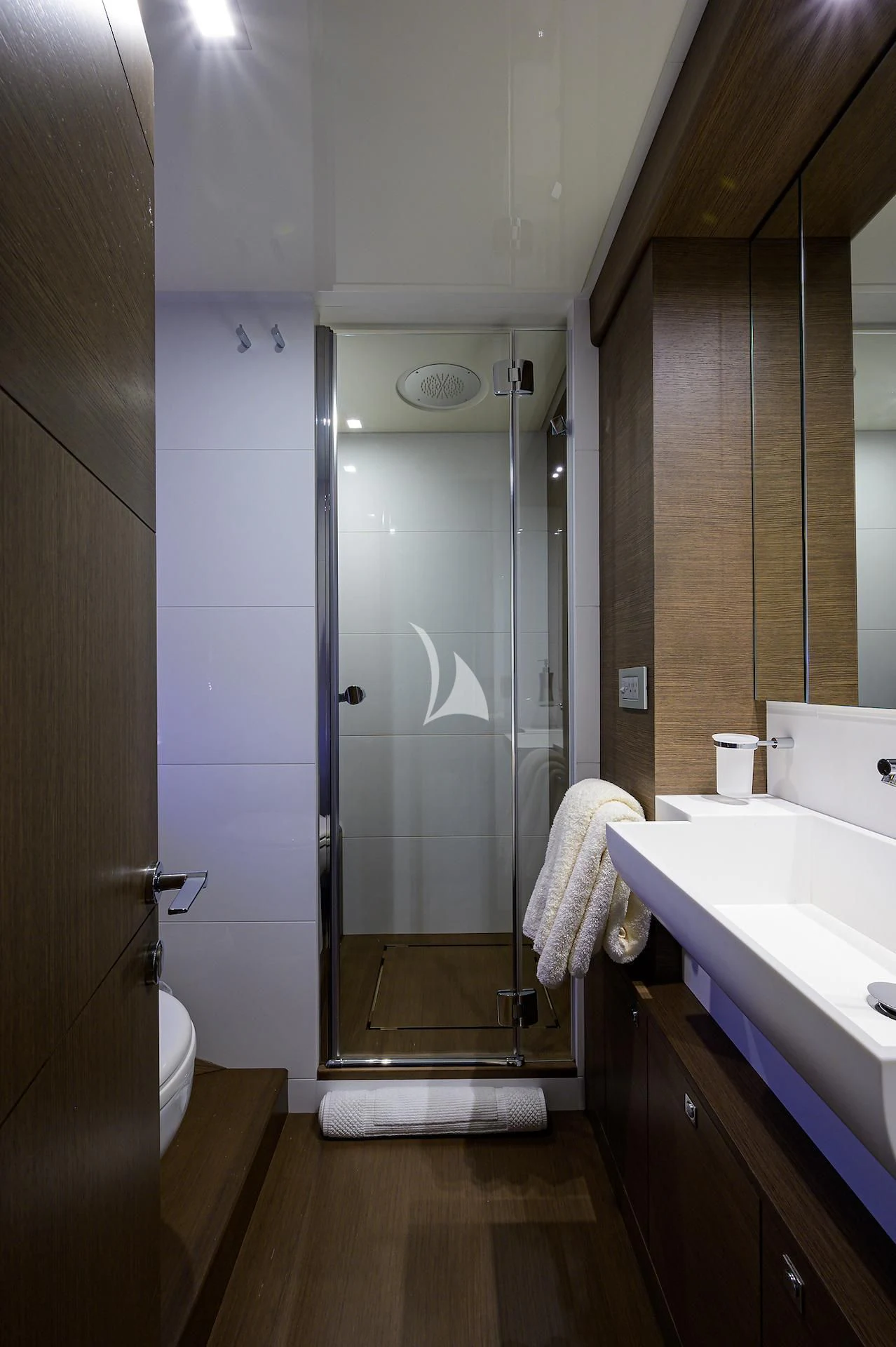 a bathroom with a shower unit and sink aboard LEON Yacht for Sale