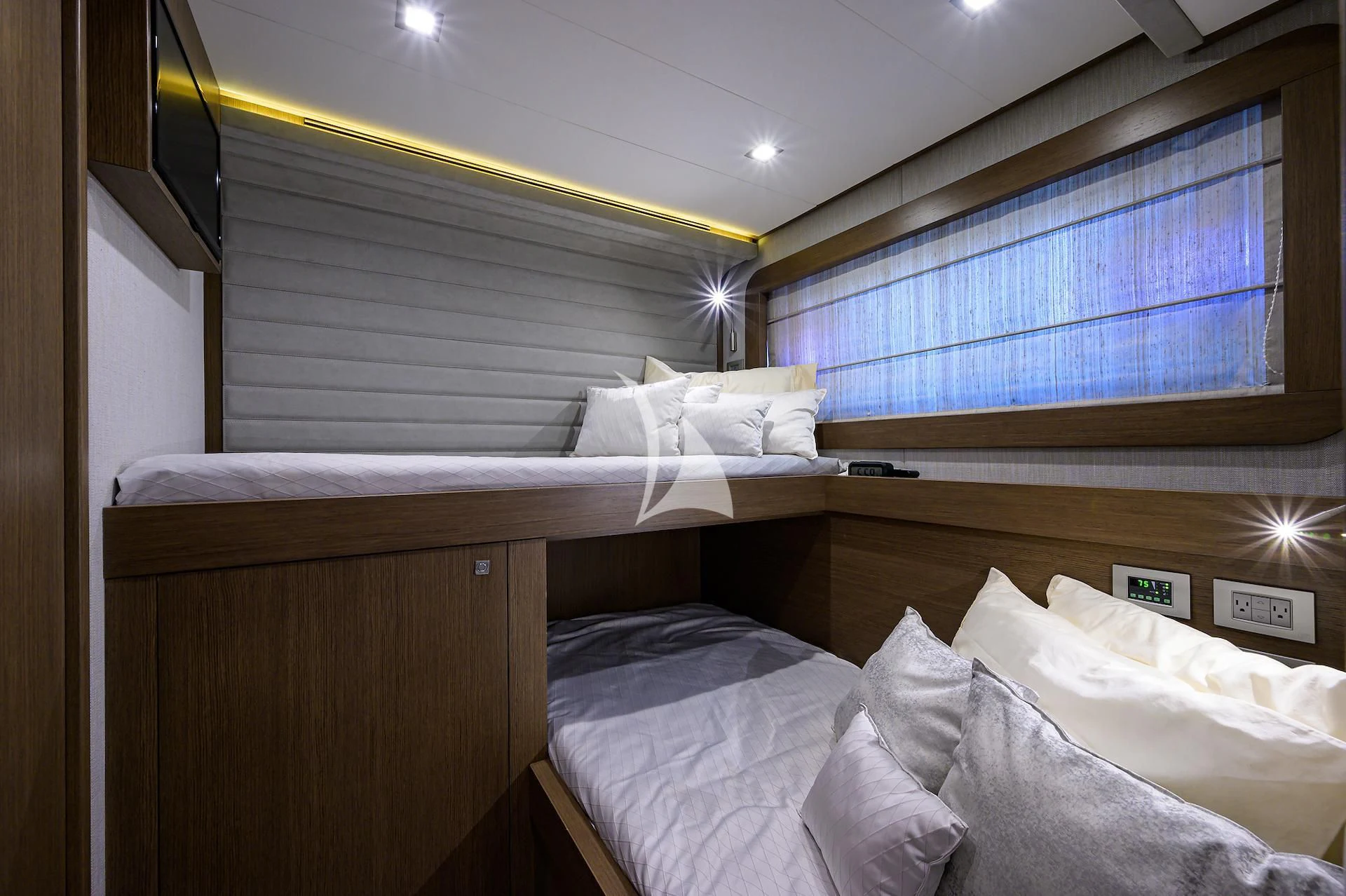 a room with a bed and a window aboard LEON Yacht for Sale