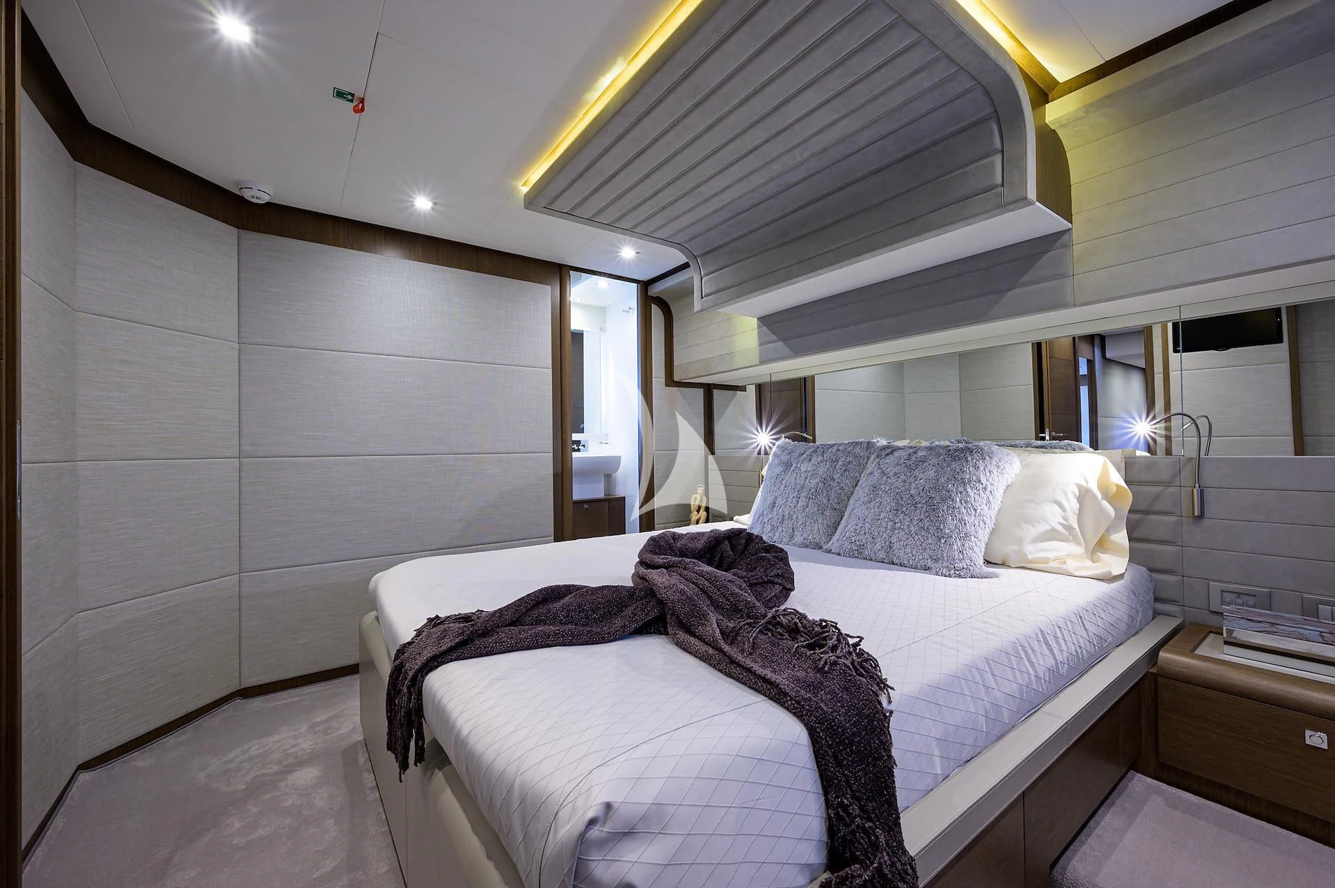 a bed with a white sheet aboard LEON Yacht for Sale