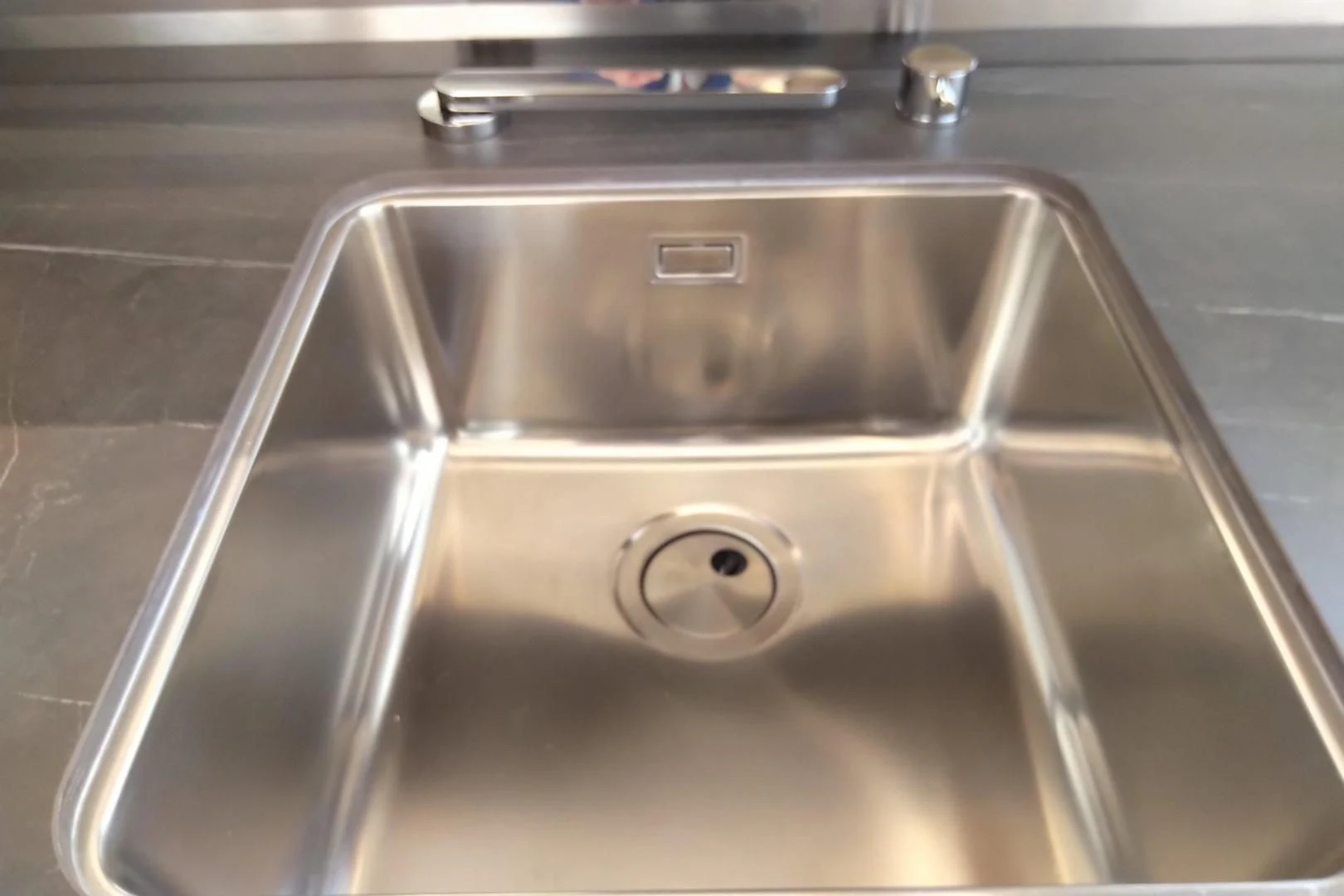 a silver sink with a faucet aboard SERENITY Yacht for Sale