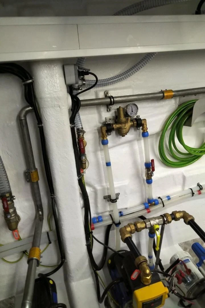 a group of pipes and wires aboard SERENITY Yacht for Sale