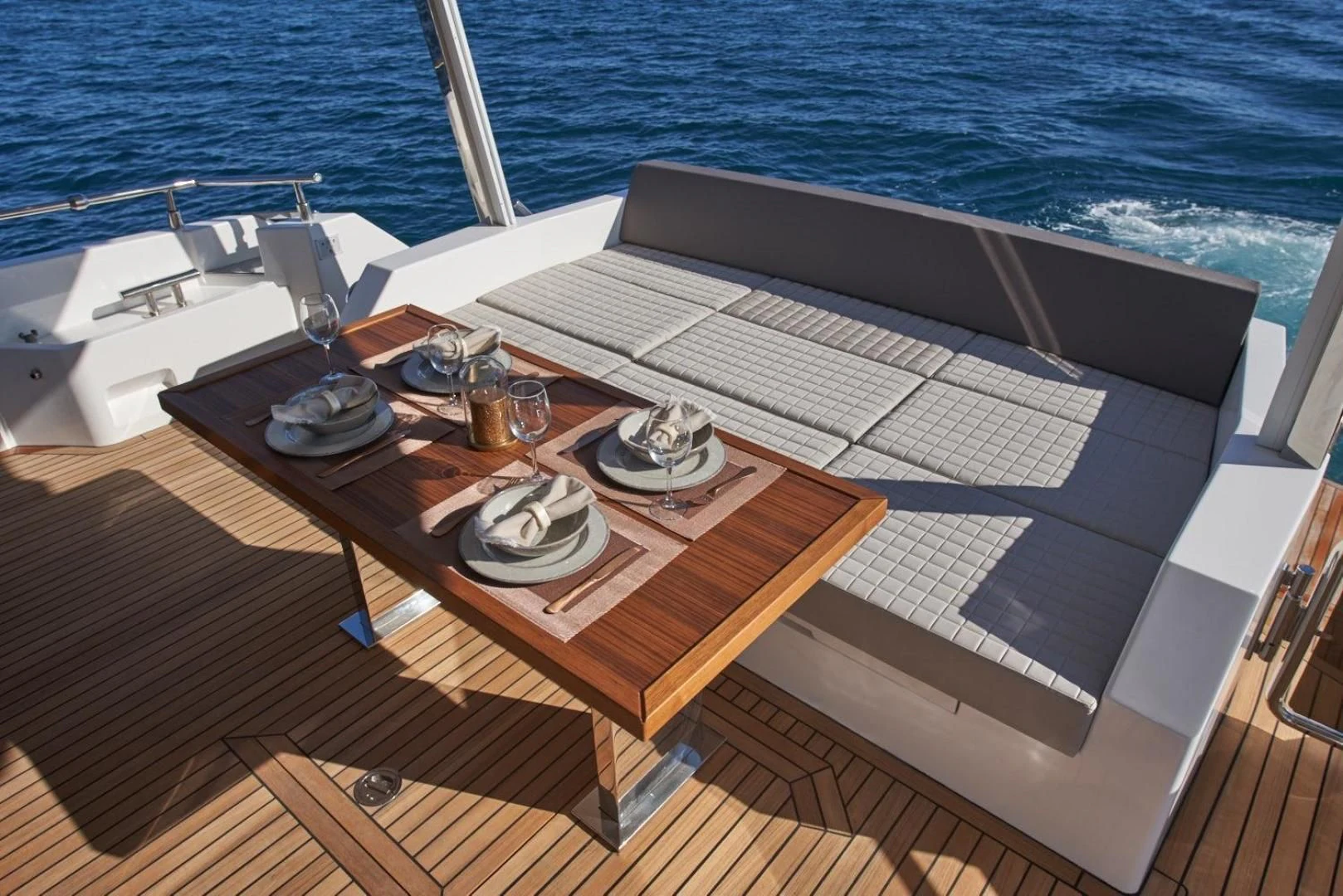 a wooden table on a boat aboard SERENITY Yacht for Sale