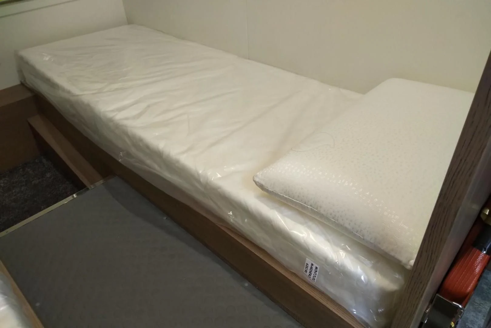 a bed with a white sheet aboard SERENITY Yacht for Sale