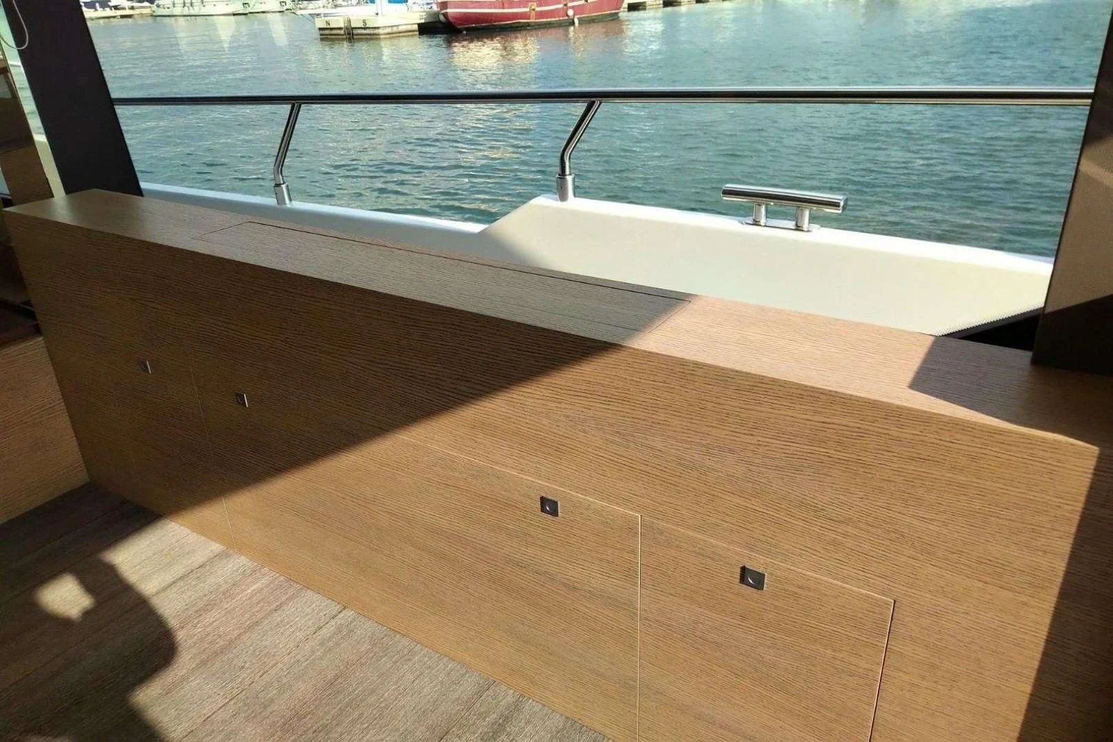 a wooden table with a glass top aboard SERENITY Yacht for Sale
