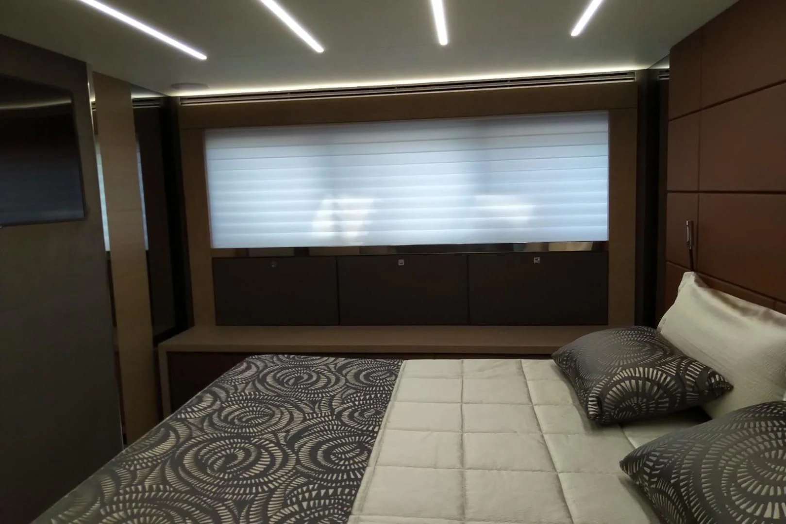 a bed with pillows aboard SERENITY Yacht for Sale