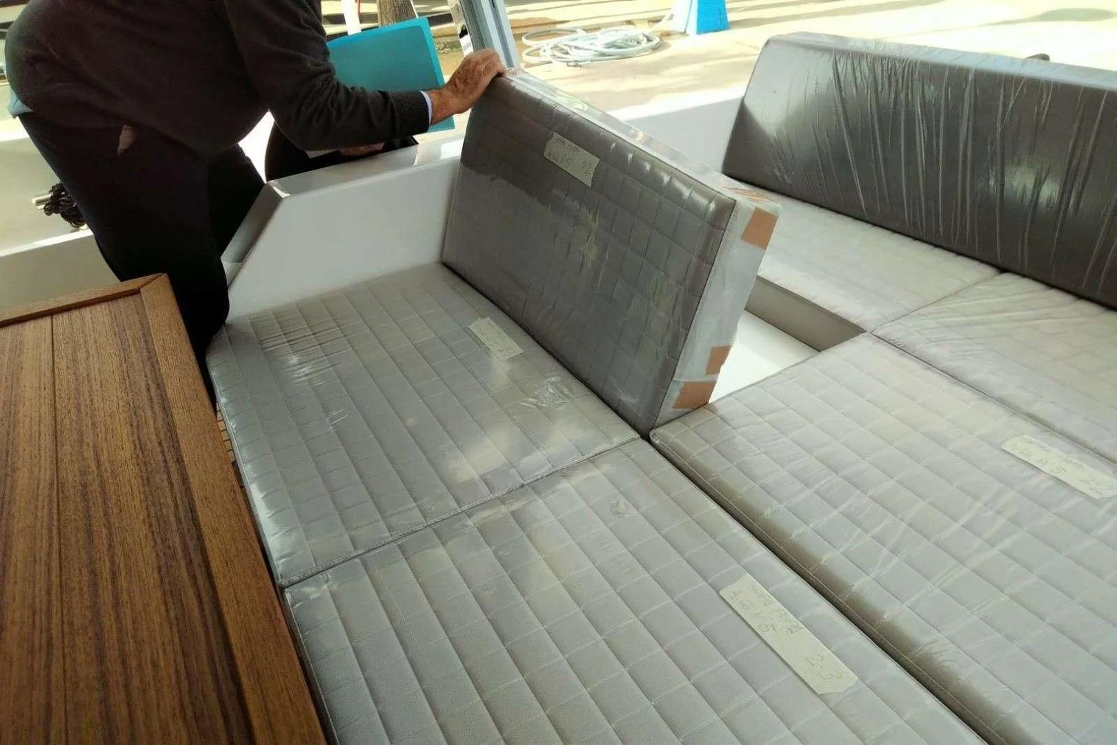 a laptop on a table aboard SERENITY Yacht for Sale