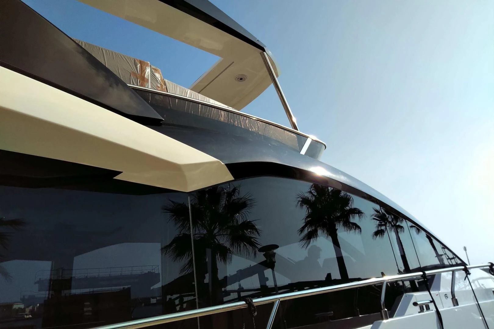 a building with palm trees aboard SERENITY Yacht for Sale