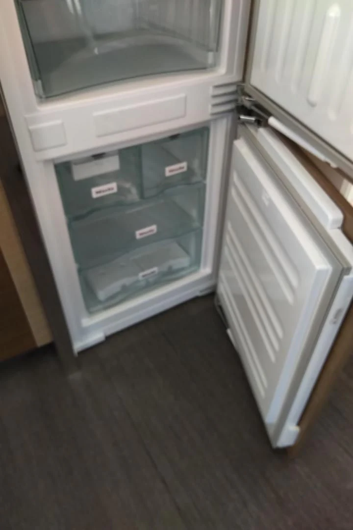 a refrigerator with a door open aboard SERENITY Yacht for Sale