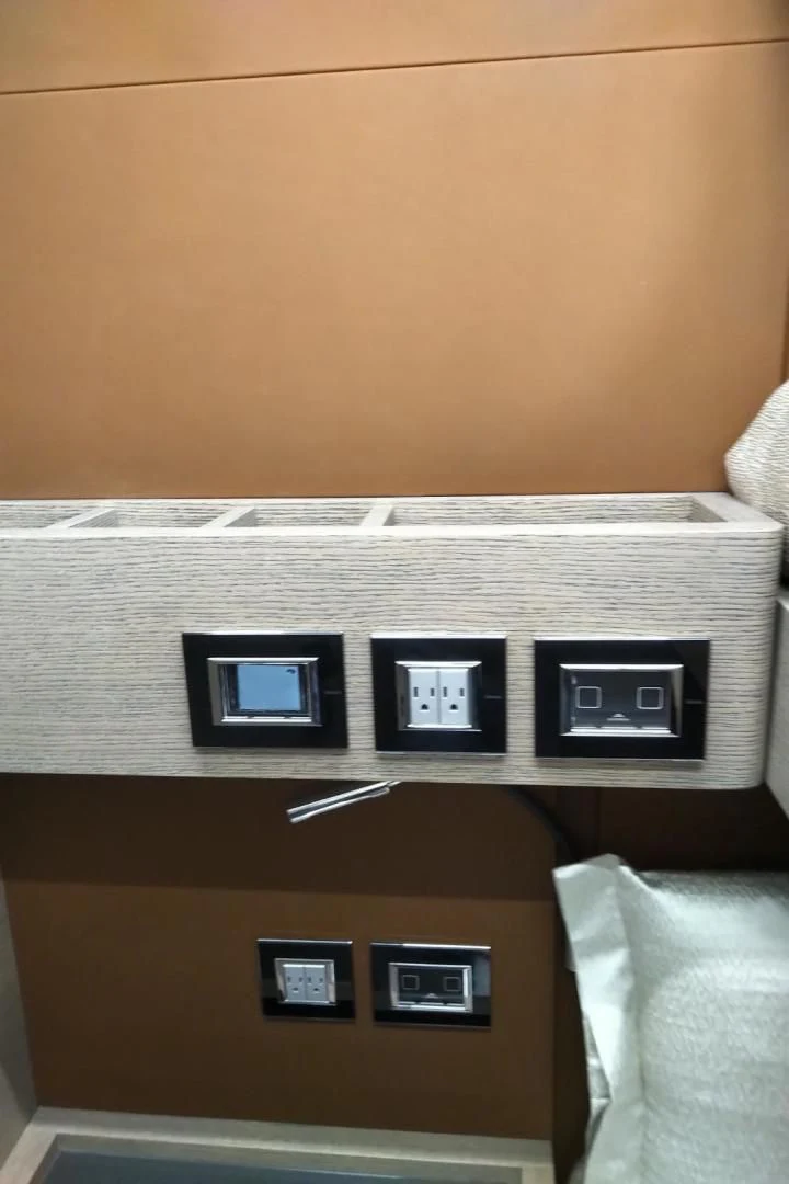 a shelf with a few switches aboard SERENITY Yacht for Sale