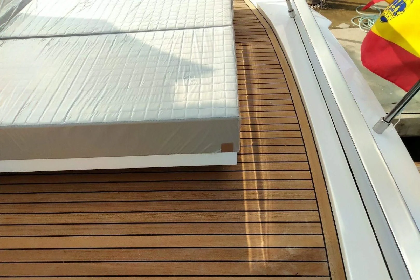 a wooden floor with a white wall aboard SERENITY Yacht for Sale
