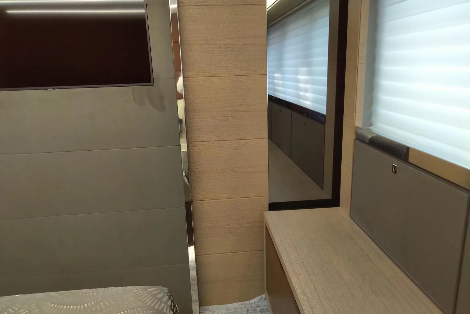 a room with a wood floor and a window aboard SERENITY Yacht for Sale
