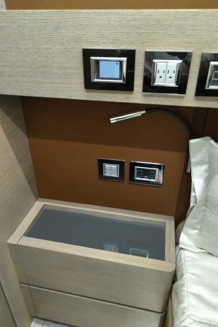 a wooden cabinet with a screen aboard SERENITY Yacht for Sale
