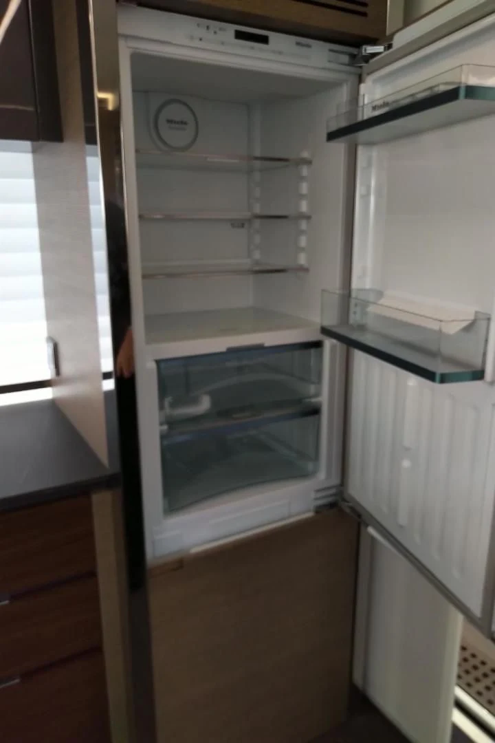 a refrigerator with its door open aboard SERENITY Yacht for Sale