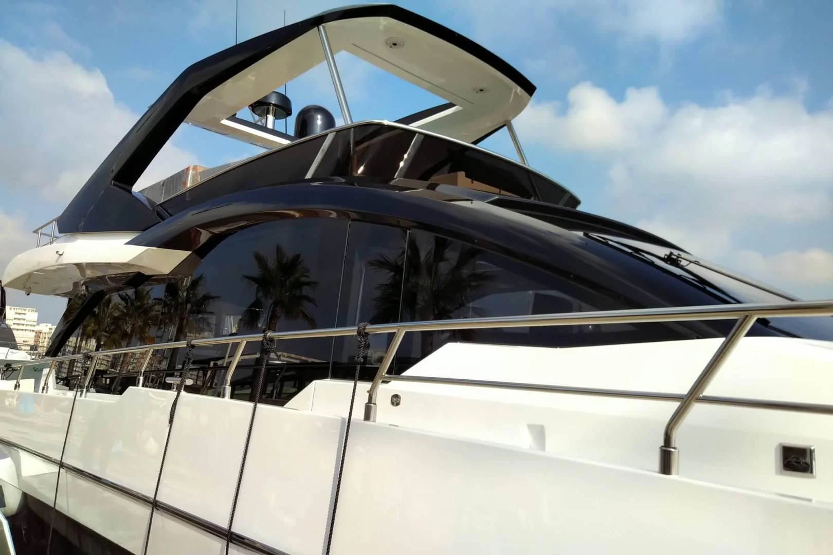 a reflection of a car in a glass building aboard SERENITY Yacht for Sale