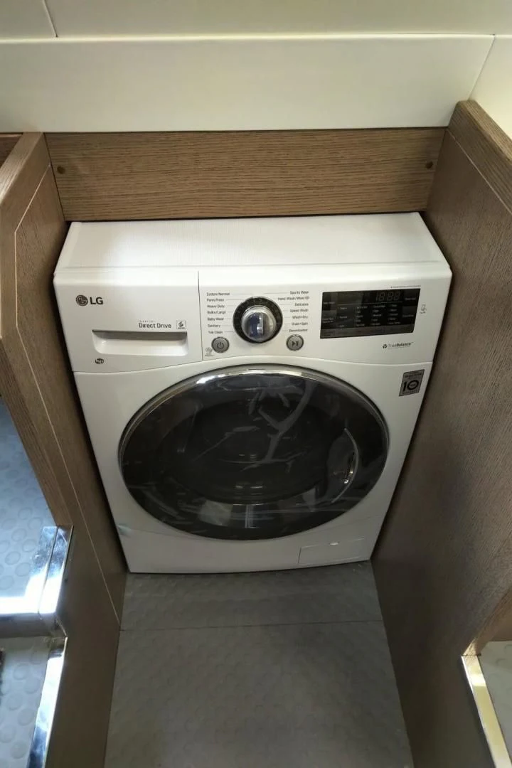 a white washing machine aboard SERENITY Yacht for Sale