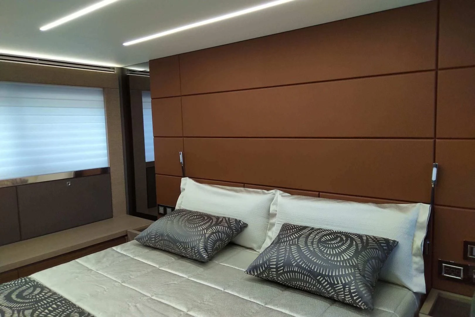 a bed with pillows aboard SERENITY Yacht for Sale
