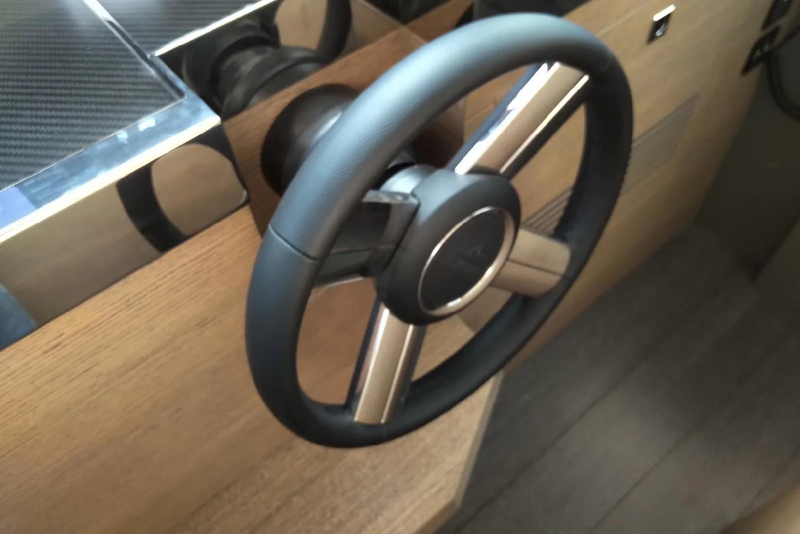 a black headphones on a wood surface aboard SERENITY Yacht for Sale