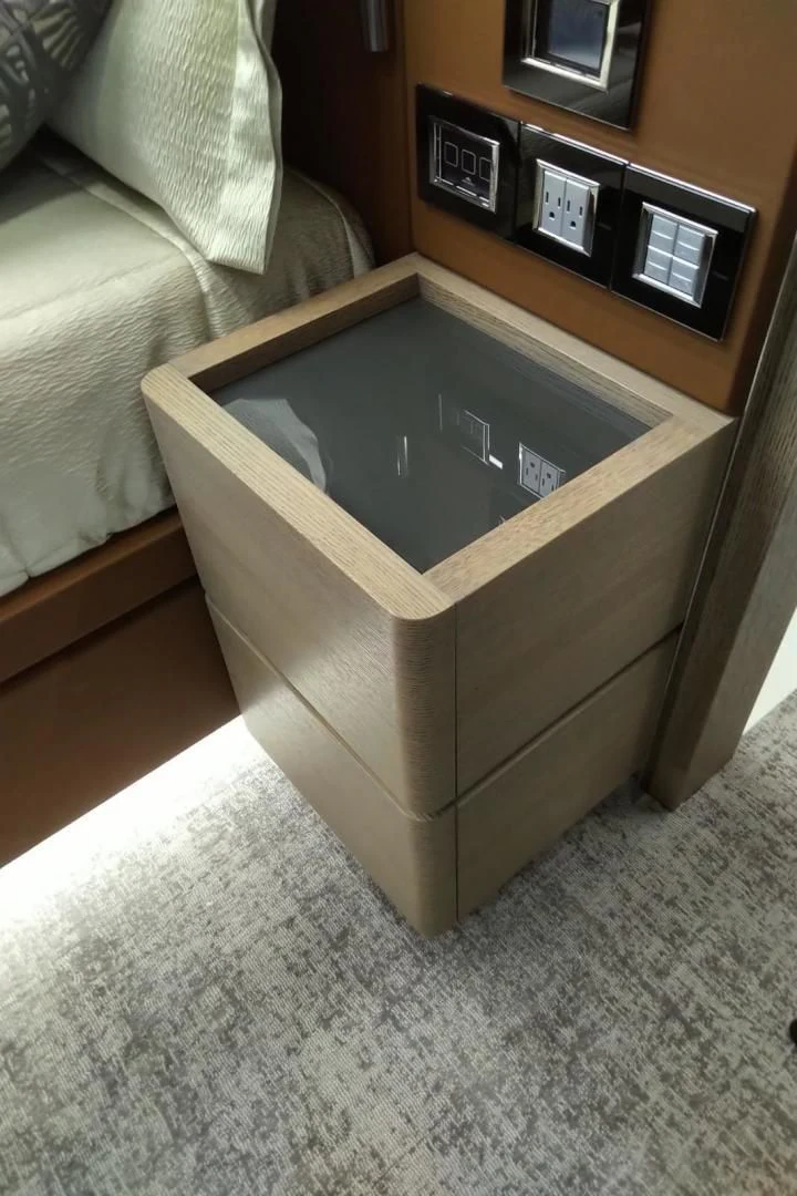 a wooden cabinet with a tv on top of it aboard SERENITY Yacht for Sale