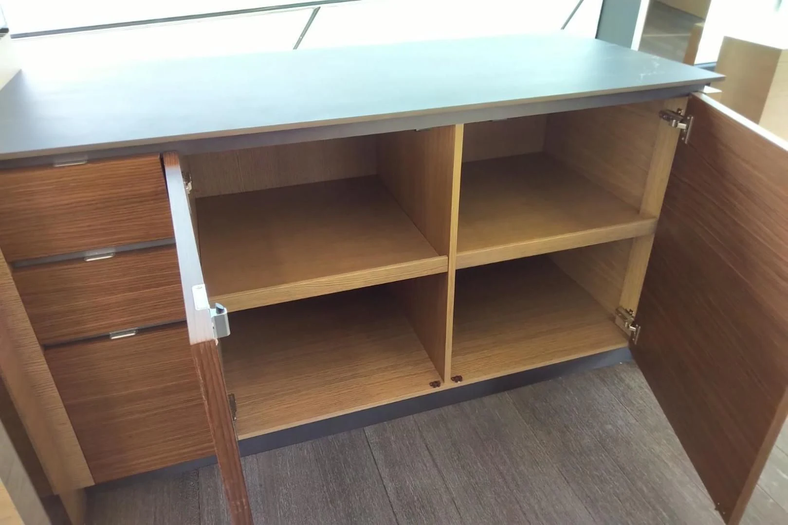 a wooden shelf with a white handle aboard SERENITY Yacht for Sale