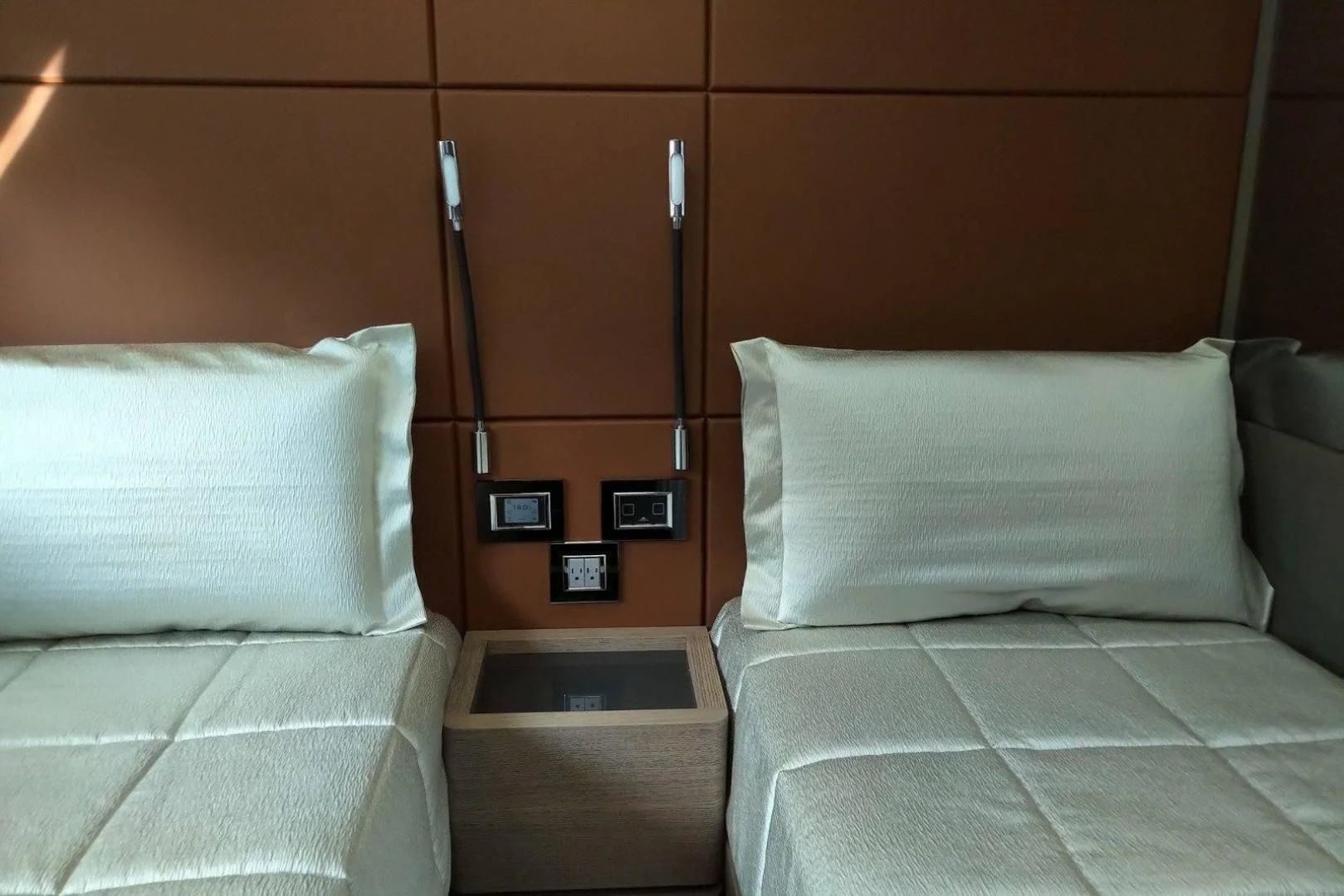 a bed with white pillows aboard SERENITY Yacht for Sale