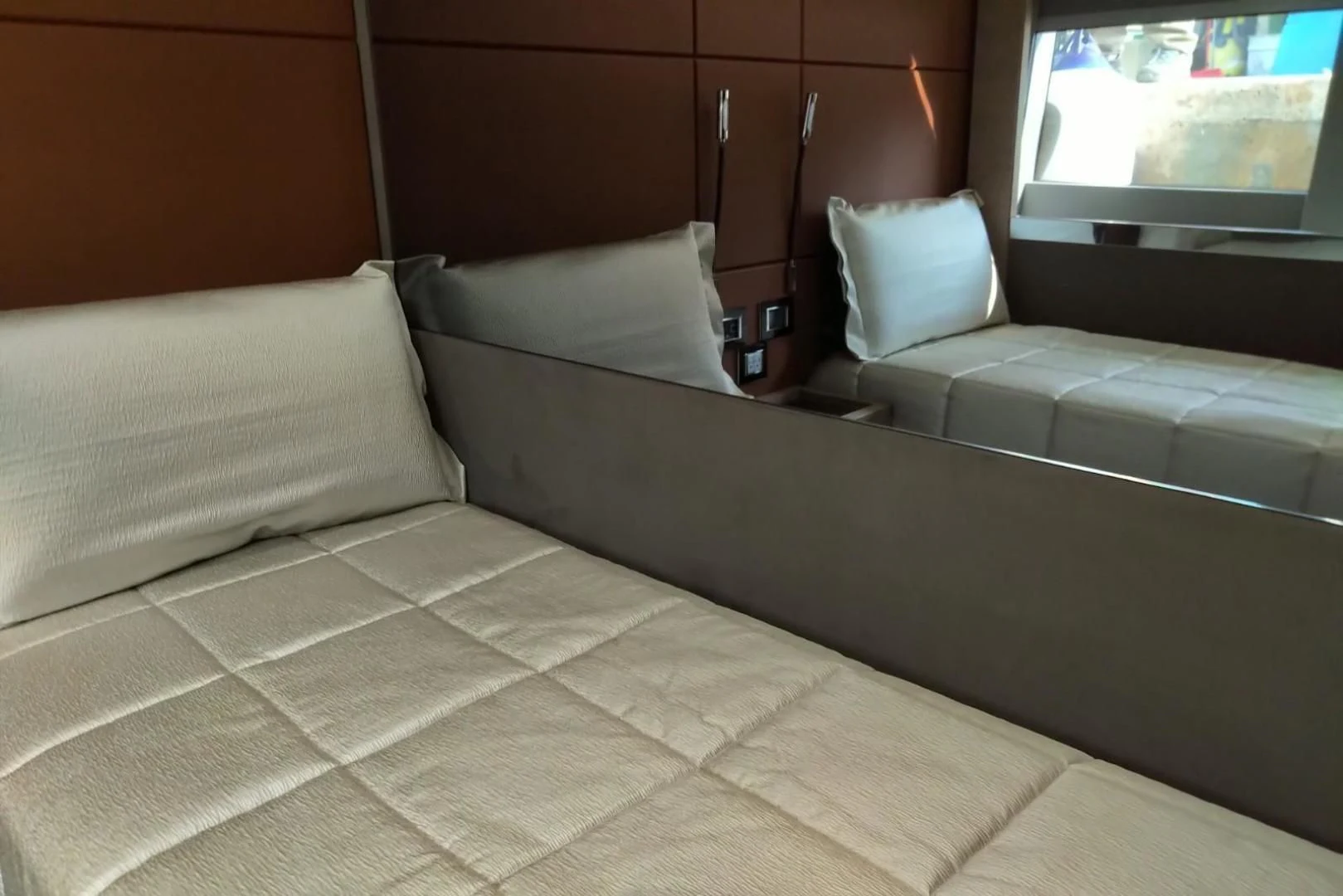 a bed with white pillows aboard SERENITY Yacht for Sale