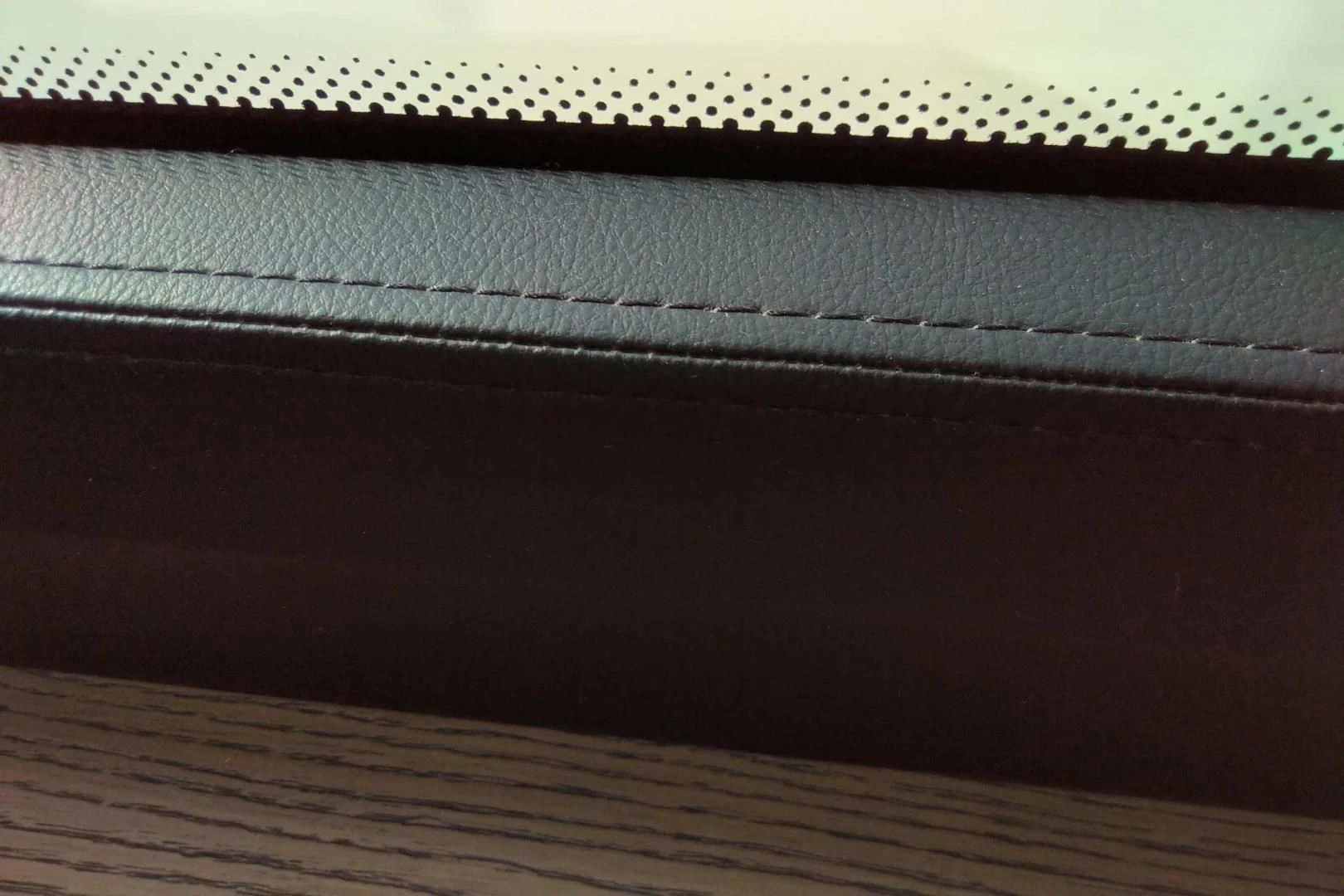a close-up of a wooden surface aboard SERENITY Yacht for Sale