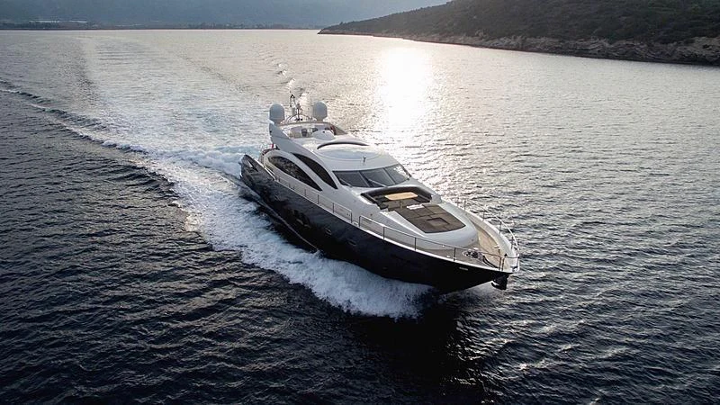 a boat driving on water aboard BLADE 6 Yacht for Charter