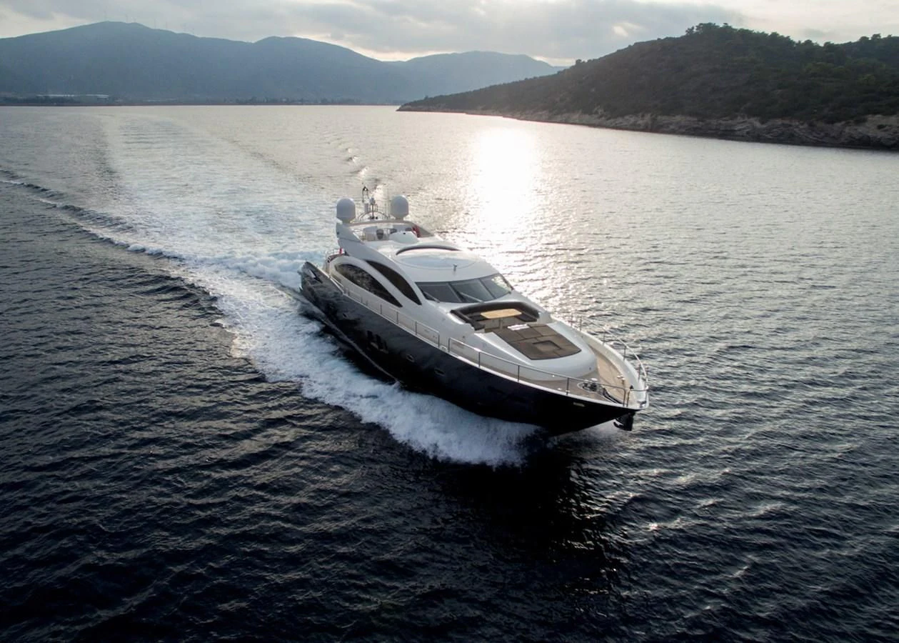 a helicopter on a water body aboard BLADE 6 Yacht for Charter