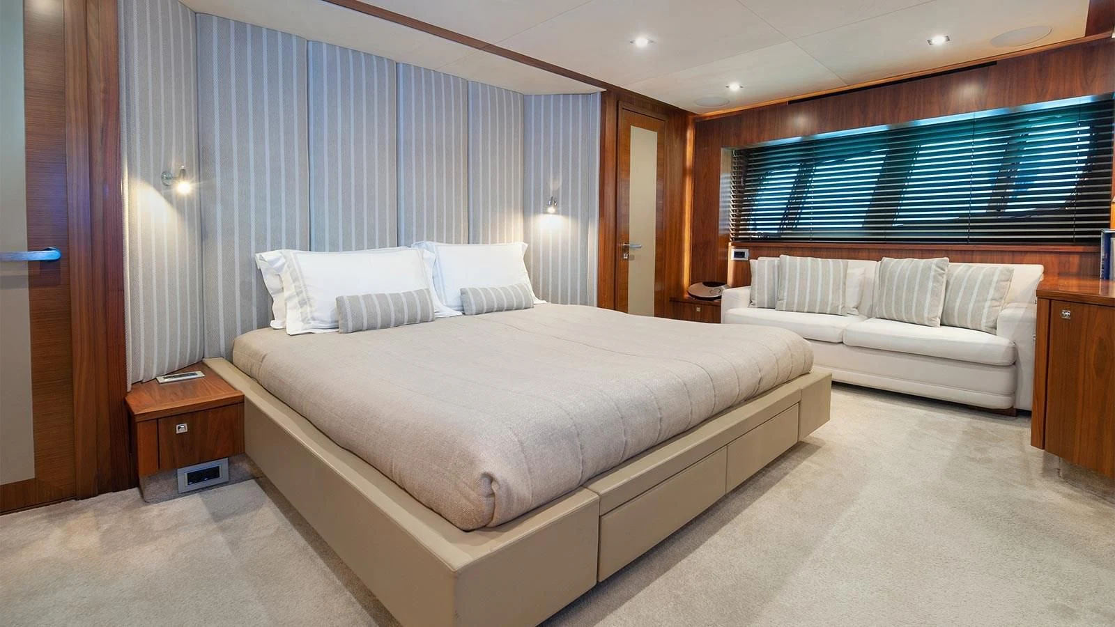 a room with a bed and a window aboard BLADE 6 Yacht for Charter